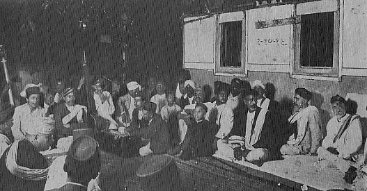 Bhaskarbuwa Bakhale in a mehfil; at extreme right is 'Lokmanya' Bal Gangadhar Tilak 