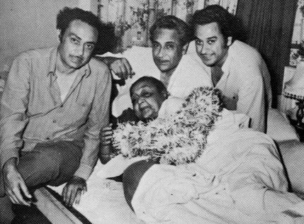 Kishore Kumar (far right), Ashok and Anoop Kumar, their mother